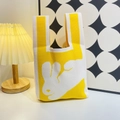 Knitted tote bag in vibrant yellow with white rabbit pattern and integrated handle - Yellow Moon Rabbit