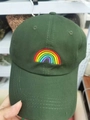 Close-up of rainbow embroidery detail on dark green cotton twill baseball cap - Dark Green
