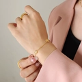Bracelet en acier titane doré avec breloques étoiles et zircons brillants pour femme - 15+5cm / Bracelet Or