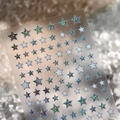 Holografische blauwe en zilveren ster nagelstickers met lasereffect op transparant vel - M-1007 Zilverzand + Plat