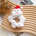 Close-up of a white plush scrunchie with a cute Santa Claus charm on a wooden tray - White Santa