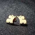 Polished gold-plated elephant stud earrings in stainless steel on black texture background - Elephant / Gold