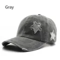 Retro washed grey baseball cap featuring sequined star patch and distressed frayed edges - Gray