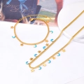 Conjunto de collar y pulsera de acero dorado con colgantes de estrella y luna azul - Set de Collar y Pulsera de Luna