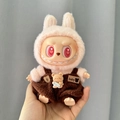 Labubu plush doll in brown outfit with pink rabbit hood accessory and heart pattern eyes - Chocolate Music Bear / First And Second Generation Keychains Are Compatible With La Cloth Dolls. Dolls Not Included.