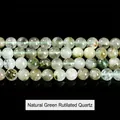 Natural green rabbit hair crystal beads in a four-row display with green hair-like needles - Natural Green Rabbit Hair Crystal / 8mm approx 47pcs