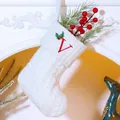 White cable knit Christmas stocking with red embroidered letter V and holly leaf detail - Letter V / White