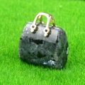 Miniature handbag pendant made of polished dark natural stone with a gold handle - Larvikite