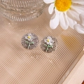 Elegant silver daisy stud earrings featuring white petals and a yellow center detail - Silver Base White Daisy Studs