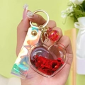 Creative liquid glitter heart keychain with red sequins and holographic wrist strap - Red