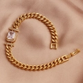 Macro shot of gold-plated cuban link bracelet featuring a rectangular white zircon stone - White Zirconia