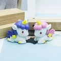 Cute resin unicorn cake toppers in pink and purple colors for birthday party decoration - Purple And Pink Eyes Open