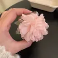 Pink chiffon flower hair clip with layered petals and green mesh leaves detail - Small Pink Flower Claw Clip