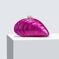 Close-up of shell-shaped acrylic clutch with purple marble texture and pearl clasp - Rose Red