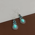 Close-up of bohemian silver earrings with turquoise stones and blue crystal accents - Oval Main Stone Blue Rhinestone Style (E2053-4)