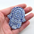Blue and white Hamsa Hand acrylic pendant with mandala pattern held in hand - Style 14