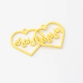 Detailed view of yellow heart-shaped pendants with flame design for DIY jewelry making - Yellow