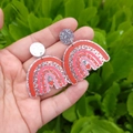 Detail of glittery rainbow arch earrings with pink hearts and silver sparkle finish - Silver Glitter Rainbow