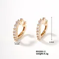 Macro shot showing dimensions of gold-plated C-shape hoop earrings with CZ pavé setting - Gold-White Zirconia