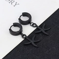 Detailed view of matte black starfish charm earrings with textured surface and sleek hoop - Large Starfish - Black