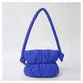Detail of blue padded nylon shoulder bag with soft pleated cloud design and wide strap - Blue