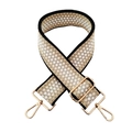 Detailed view of thick adjustable strap with geometric honeycomb pattern and gold metal hooks - Black Border Beige