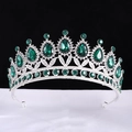 Detailed view of baroque silver crown with emerald teardrop gems and sparkling rhinestones - Silver With Green