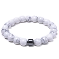 Macro detail of 8mm white turquoise beads with a black magnetic cylinder spacer bead - White Howlite Bracelet