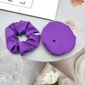 Detailed view of a purple fabric hair scrunchie and matching drink cover on a plate - 2-Piece Set (Scrunchie + Cup Cover) / Purple