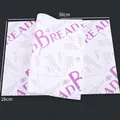 Food grade greaseproof sandwich paper with purple bread print, size 38cm x 28cm - Purple Text Type 2 (50 Sheets)