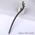 Handcrafted 18cm dark ebony wood hair pin featuring an elegant minimalist antler design - Antler