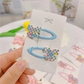 Detail of light blue butterfly hair clips with colorful beads on a white card - Blue Pearl Butterfly BB Clips (Pair)