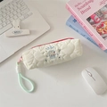 Detail of white quilted pencil case featuring a cute rabbit embroidery and red zipper - Happy Rabbit