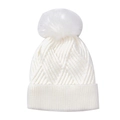 Close-up of white cable knit beanie with faux fur pom pom and ribbed cuff texture - Geometric Knit Beanie / White