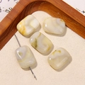 Detailed macro view of square natural agate beads with textures on a wooden tray - Milky White Beige Textured Square Style (17号)