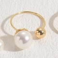 Minimalist open ring featuring a large white pearl and gold metal bead in 14K gold finish - Large and Small Pearls Metal Ball
