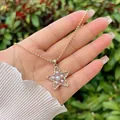 Detail of star pendant necklace with faux pearls and golden beaded chain in close-up view - White 2 (Star)