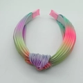 Close-up of tie-dye rainbow pleated headband with a top knot and fabric texture - Headband / Light Blue Purple Pink Gradient