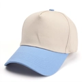 Detail view of a two-tone baseball cap with beige crown and light blue curved brim - Adjustable / Beige/Light Blue