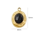 Detail van een 12x8mm ovale zwarte edelsteen hanger met verguld roestvrijstalen frame - Zwarte agaat