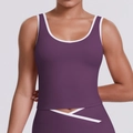 Detail of cross V-waistband on purple yoga leggings with white contrast stripe trim - S / Giga Purple