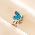 Macro shot of heart-shaped blue turquoise ring with silver filigree adjustable band - Adjustable Open / Silver-Deep Blue Texture
