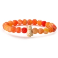 Detail view of orange tiger eye beads and cute penguin pendant on elastic bracelet - Orange Weathered Stone
