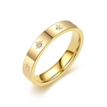 Detailed view of a gold titanium steel ring with sparkling star and crystal engravings. - Size 6 / Gold