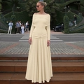 Detailed view of the off-shoulder neckline and pleated waist of the beige maxi dress - S / Apricot