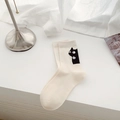 Cute cream-colored mid-calf socks featuring a black cat design with bell detail - Mid-calf Socks-White