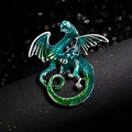 Blue and green gradient dragon brooch with silver metal lines on a dark background - Malachite green