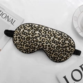 Silky leopard print sleep mask with black elastic strap on aesthetic background - Leopard Print