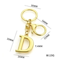 Golden stainless steel letter D keychain with lobster clasp and dimensional measurements - Letter D