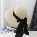 Close-up of beige straw sun hat featuring elegant black wide ribbon and bow detail - M (56-58cm) / Beige